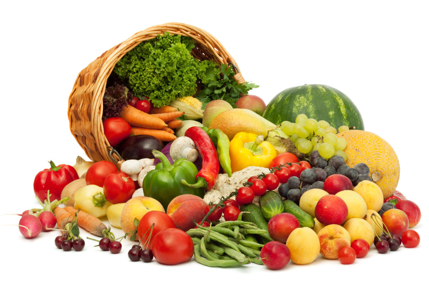 Assorted fruits and vegetables on a white background signifying Herbalife Vegetarian Product Range.